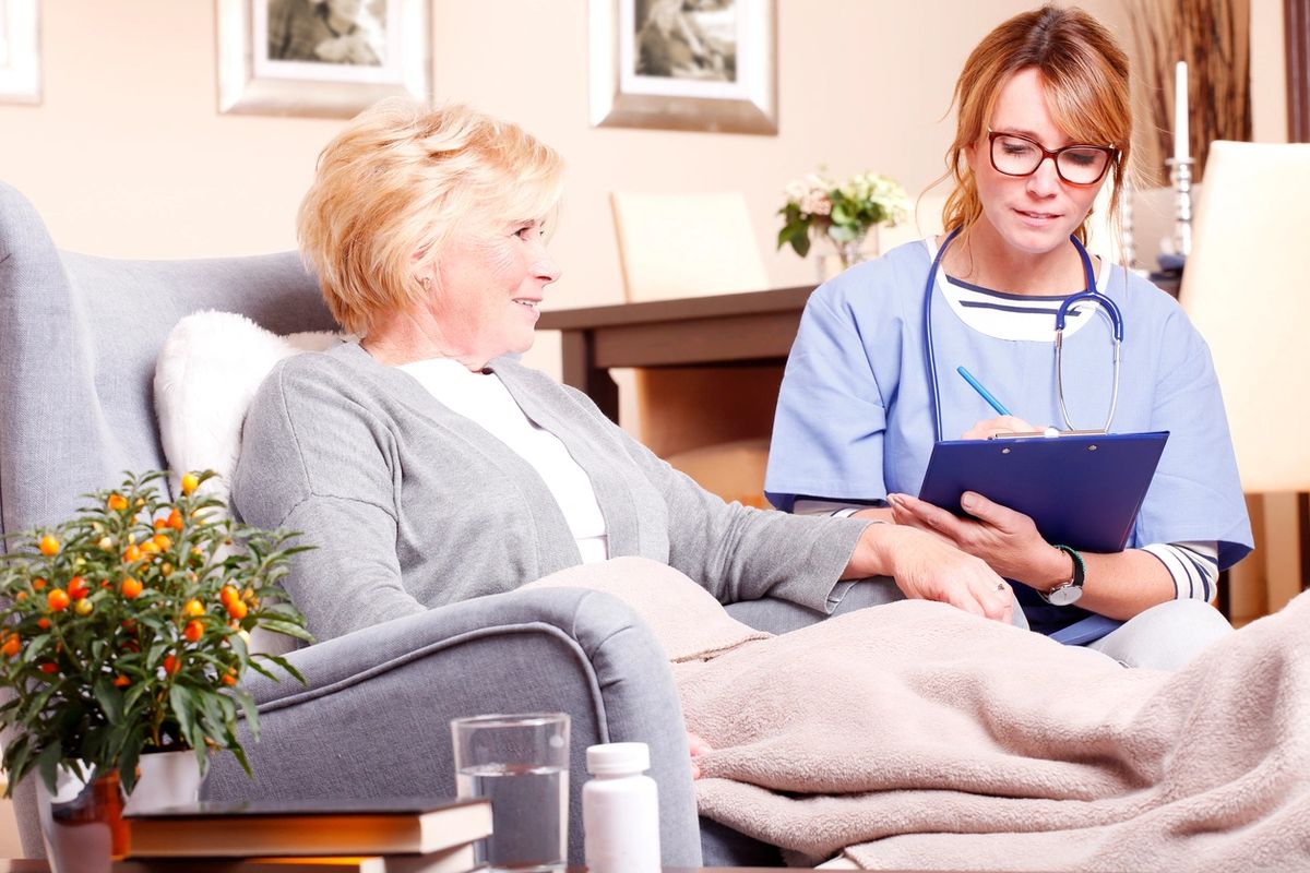 Support worker alongside a person at home